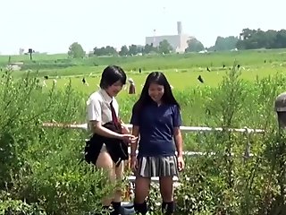 Cute asian teens squatting